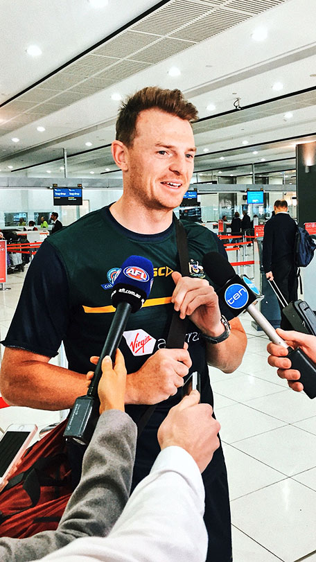 goddard-irs-airport-350.jpg Brendon Goddard speaking to reporters at Melbourne airport on Thursday - AFL,Brendon Goddard,International Rules,Essendon Bombers,Dustin Fletcher